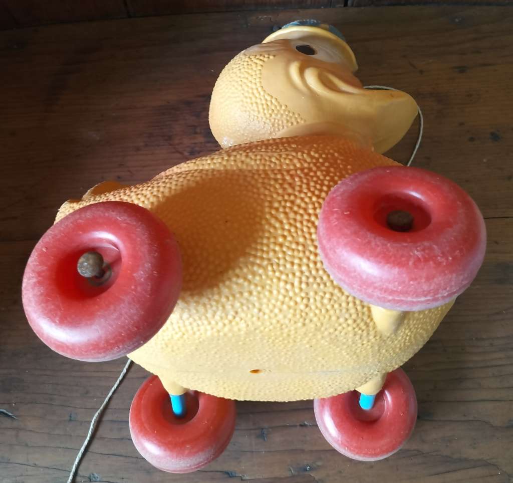 Vintage plastic pull-along duck on wheels