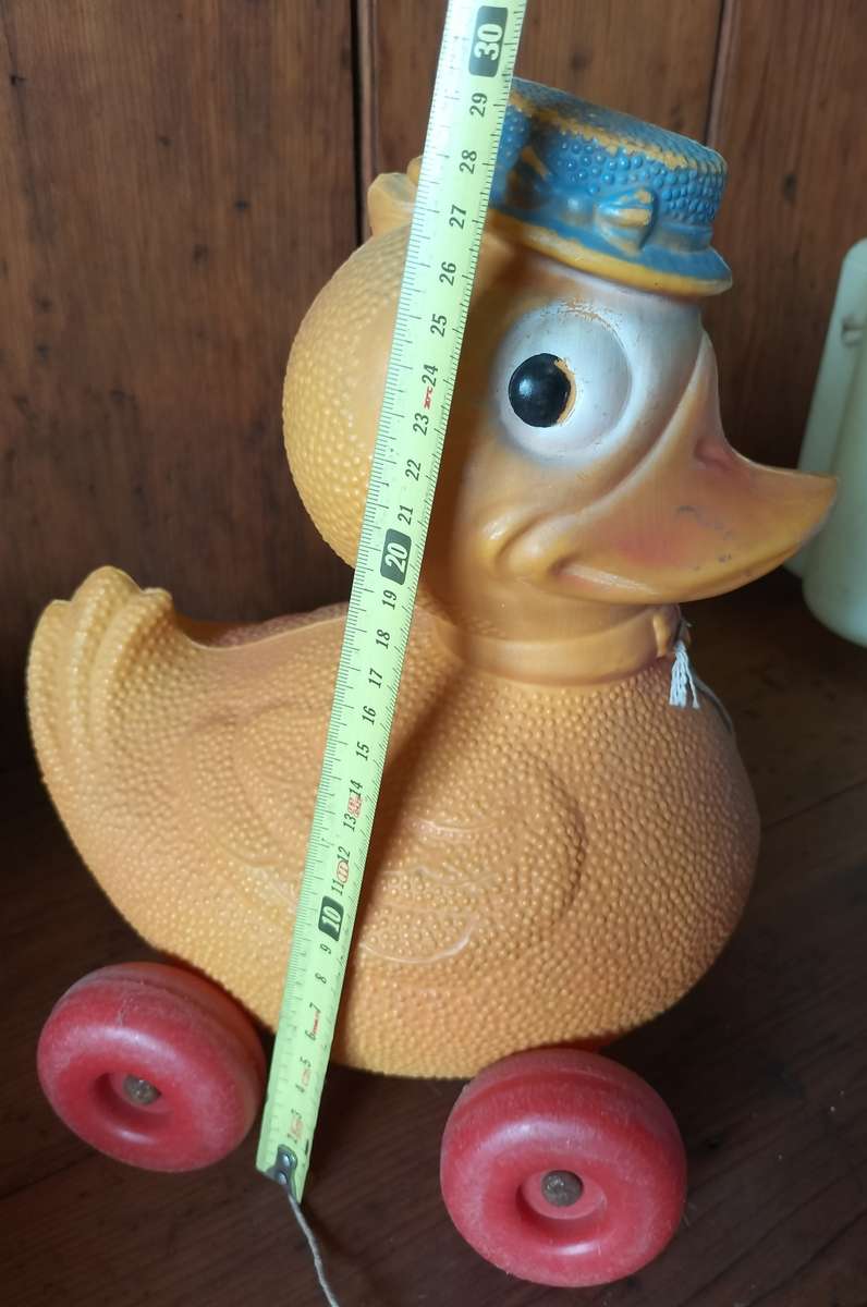 Vintage plastic pull-along duck on wheels