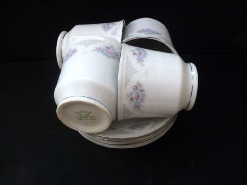 Four Cups and Saucers. Dainty Flowers and Lace Pattern. No Chips, no cracks. Made in China.