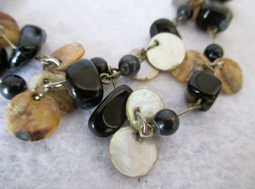 Lovely Mother of Pearl discs with black semi precious stone necklace. 90cm.