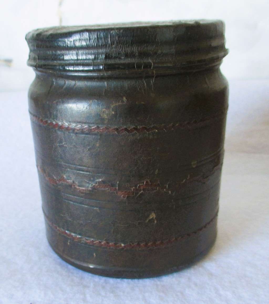 Prisoner of war trench art leather covered cigarette tins. 100mm and 85mm high. Very collectable