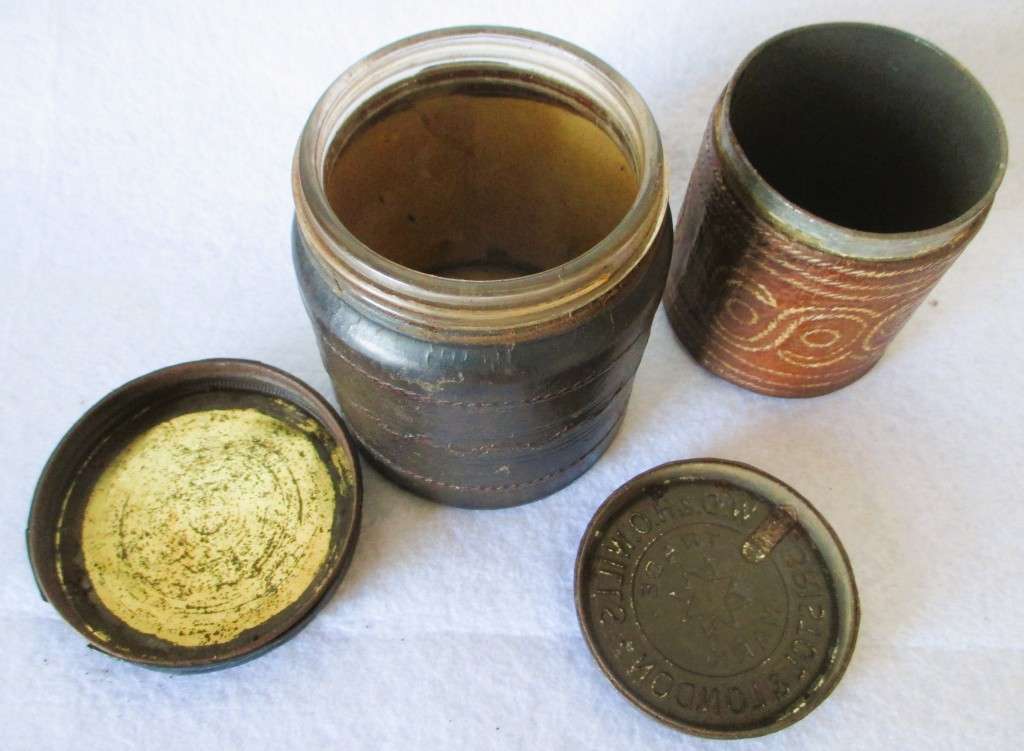 Prisoner of war trench art leather covered cigarette tins. 100mm and 85mm high. Very collectable