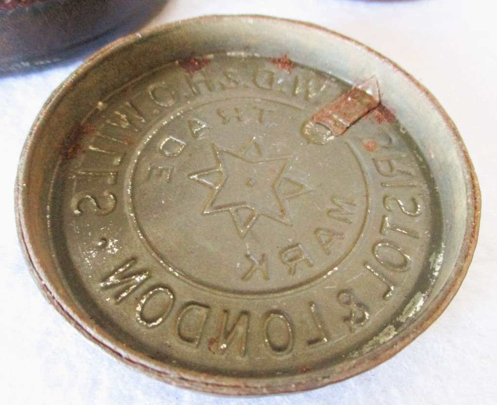 Prisoner of war trench art leather covered cigarette tins. 100mm and 85mm high. Very collectable