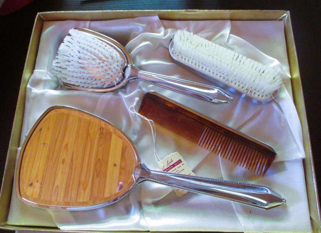 Vtage ladies dressing table set, hair brush, mirror, comb and clothes brush in silver finish, in box