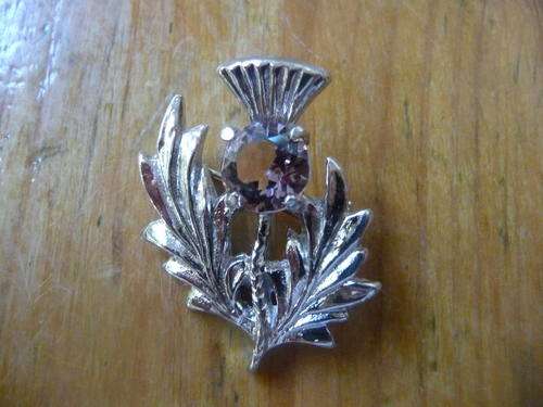 Vintage Scottish Thistle brooch with light pink stone.