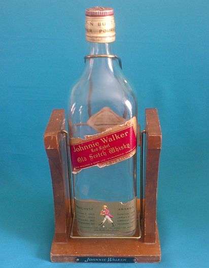 LARGE JOHNNIE WALKER GLASS BOTTLE ON WOODEN STAND
