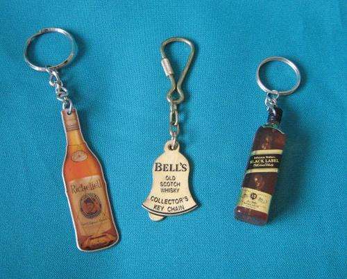 3 ASSORTED LIQUOR KEY RINGS (BELL'S, JOHNNIE WALKER ETC.)