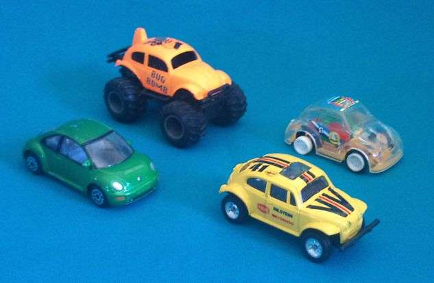 4 ASSORTED VW BEETLE MATCHBOX SIZE CARS