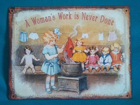 "A WOMAN'S WORK IS NEVER DONE" TIN/ METAL SIGN