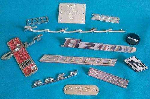 LOT OF OLD CAR BADGES