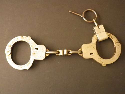OLD PAIR OF HANDCUFFS + WORKING KEY