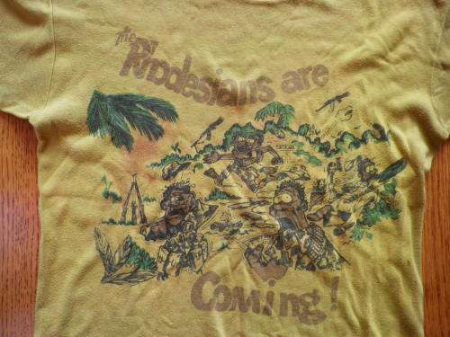 "THE RHODESIANS ARE COMING"  ICONIC TEE SHIRT FROM THE BUSH WAR - MADE BY MONOGRAM - SIZE 102 CM