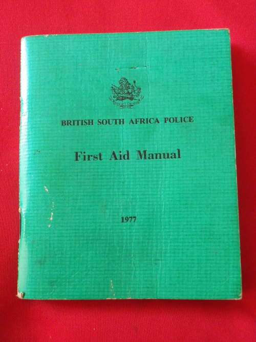 RHODESIA - BSAP FIRST AID MANUAL 1977 - 140 PAGES. INSCRIBED - (2605)