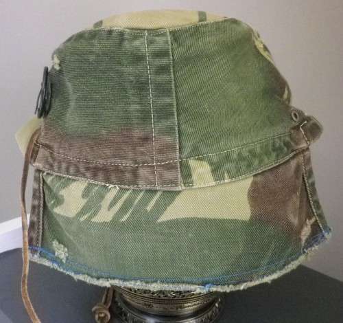 RHODESIAN -  CAMO CAP - PART OF FLAP CUT OFF BY OWNER - HAS ORIGINAL ORANGE LINING -  (5454)