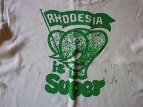 "RHODESIA IS SUPER" TEE SHIRT - MADE MONOGRAM SIZE 75CM / SMALL - SOME DISCOLOURATION    (6633)