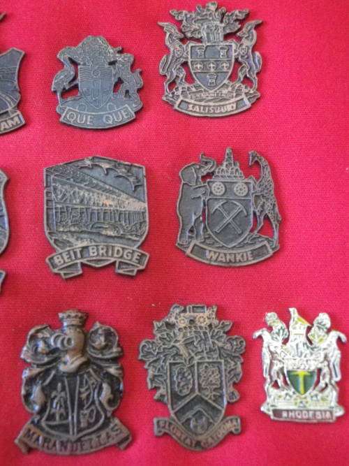RHODESIAN LOT  - 16 X CITY / TOWN / PLACE CRESTS - OFF A DISPLAY - HAS MOUNTING RESIDUE ON REVERSE