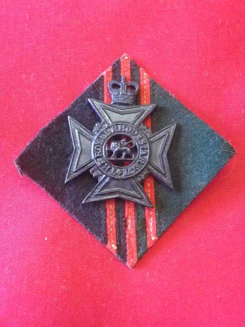 ROYAL RHODESIA  REGT.  QC BLACKENED BRASS CAP BADGE ON SCARCE 3Bn. (NR)   BACKING       (2381)
