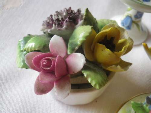 4 SMALLPRETTY  PORCELAIN ITEMS - NOTE 1 CHIP ON FLOWER OF LID OF THE BOX...OTHERS IN GOOD CONDITION