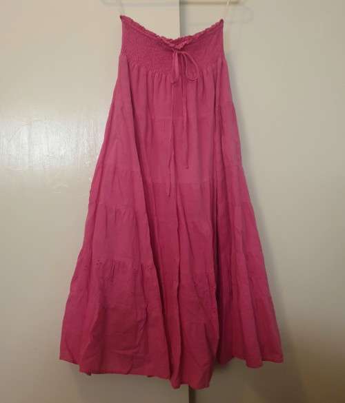Long cerise pink skirt lined with elasticated waist by Legend Size: 10