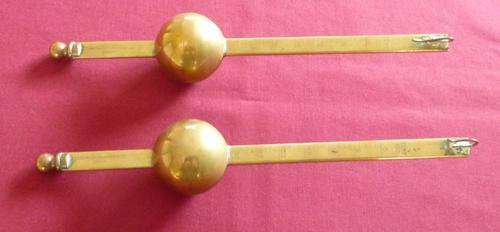 Two brass alcohol measures