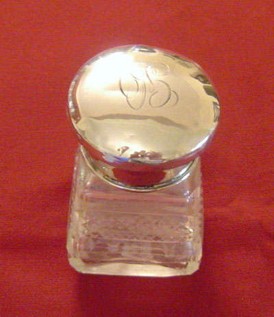 Silver topped smelling salts bottle