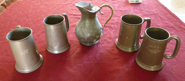 Four pewter mugs and a lovely jug