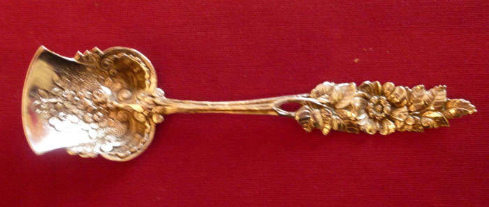 Ornate continental silver sugar spoon