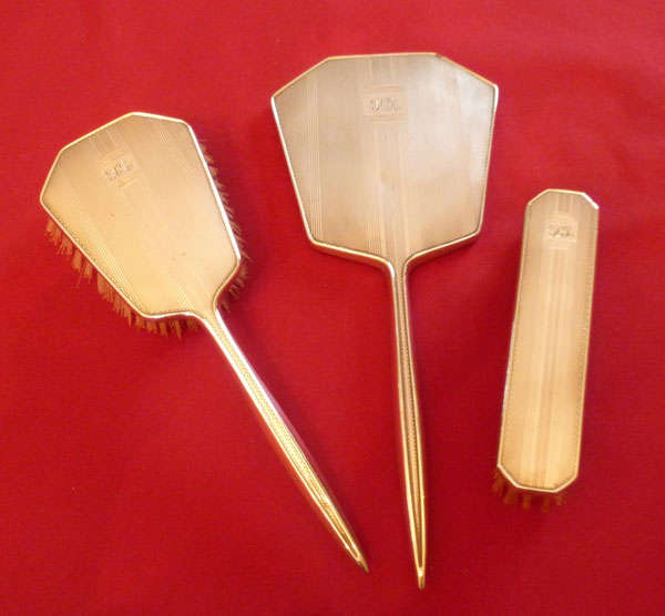 Three piece silver brush and mirror set