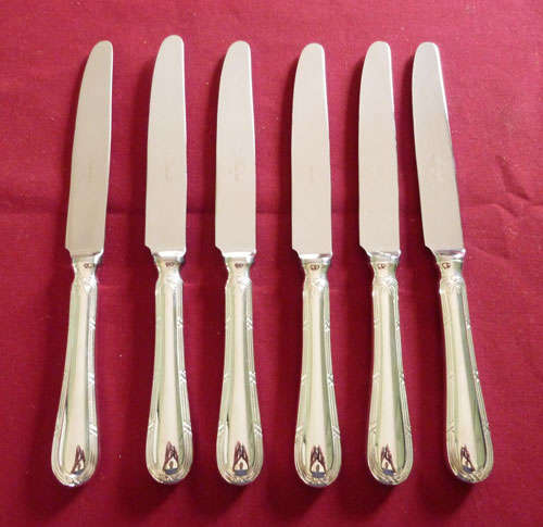 Six silver plated table knives
