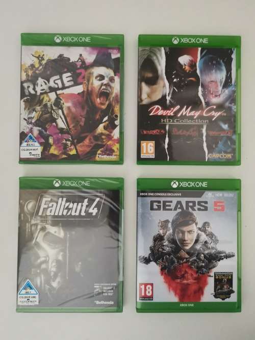 Xbox One X Console Bundle (Console + 4 Games and Controller Battery Pack)