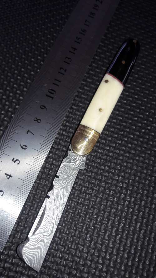 DAMASCUS Hand Made Joseph Rogers style folding knife, camel bone and bull horn handle scales.