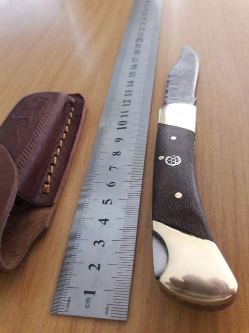 Handmade Damascus steel folding knife with Wooden handle scales. I CAN SEND PARCELS.