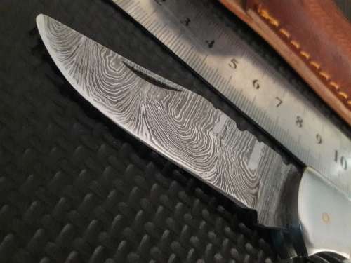 Handmade Damascus steel folding knife with WOOD & CAMEL BONE handle scales.