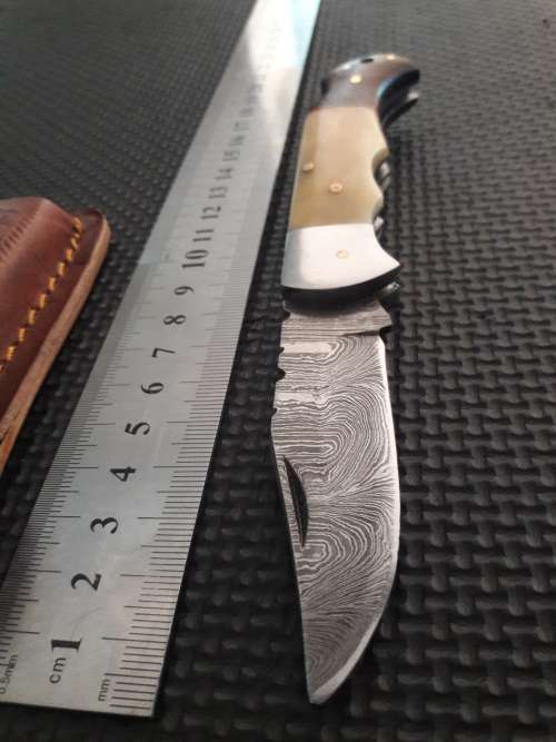 Handmade Damascus steel folding knife with WOOD & CAMEL BONE handle scales.