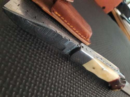 Handmade Damascus steel folding knife with WOOD & CAMEL BONE handle scales.