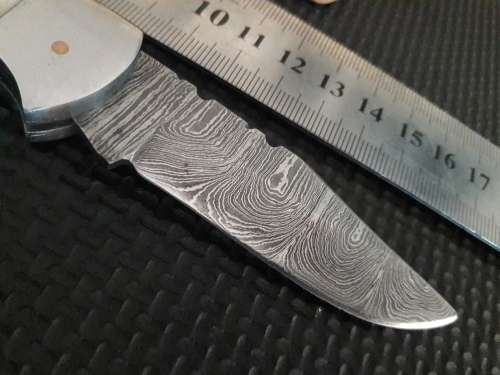 Handmade Damascus steel folding knife with WOOD & CAMEL BONE handle scales.