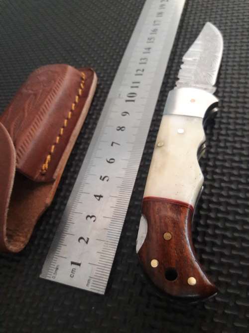 Handmade Damascus steel folding knife with WOOD & CAMEL BONE handle scales.