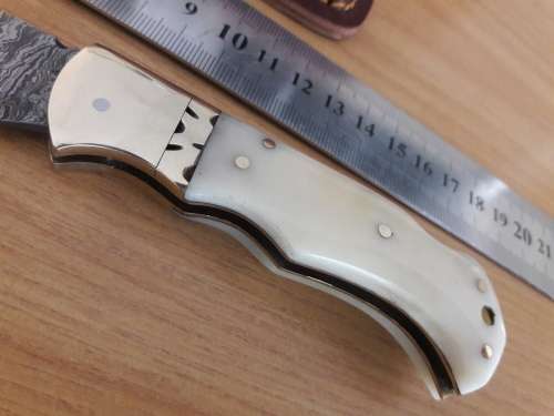 Handmade Damascus steel folding knife with CAMEL BONE handle scales.