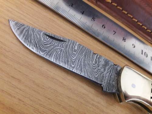 Handmade Damascus steel folding knife with CAMEL BONE handle scales.
