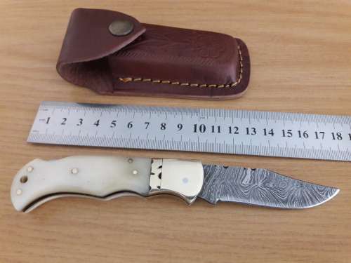 Handmade Damascus steel folding knife with CAMEL BONE handle scales.