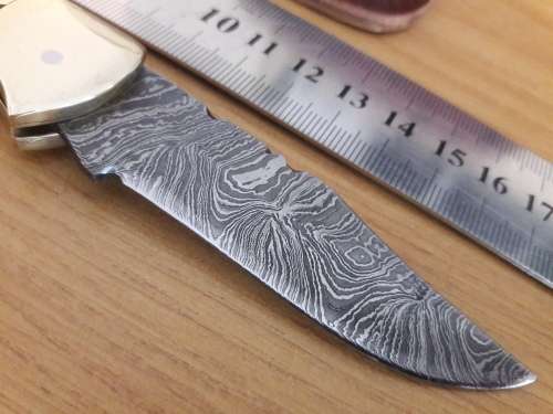 Handmade Damascus steel folding knife with CAMEL BONE handle scales.