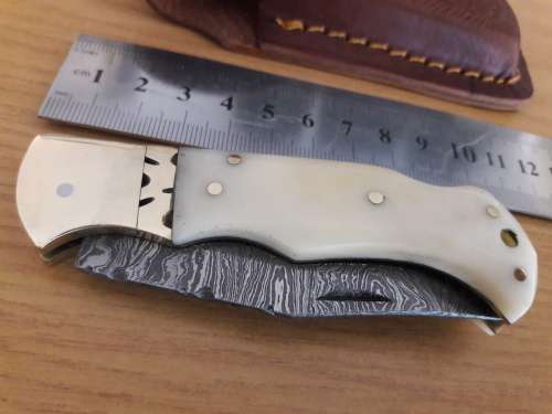 Handmade Damascus steel folding knife with CAMEL BONE handle scales.