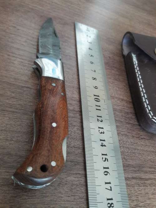 Handmade Damascus steel folding knife with WOODEN handle scales.