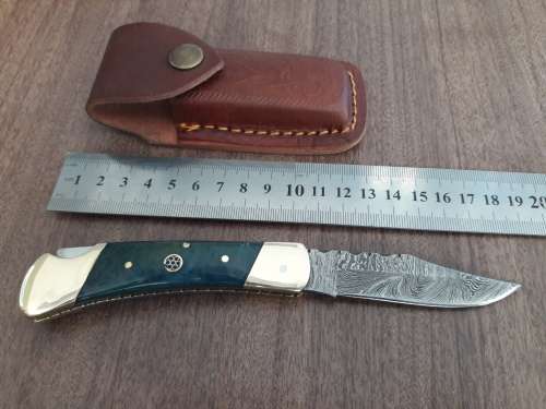 Handmade Damascus steel folding knife with CAMEL BONE handle scales.