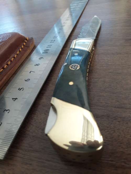 Handmade Damascus steel folding knife with CAMEL BONE handle scales.