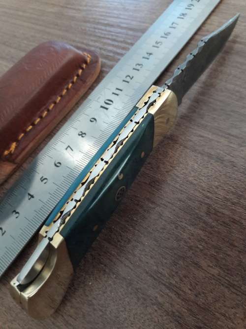 Handmade Damascus steel folding knife with CAMEL BONE handle scales.