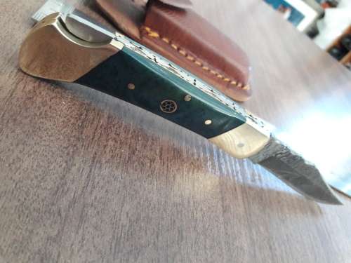 Handmade Damascus steel folding knife with CAMEL BONE handle scales.