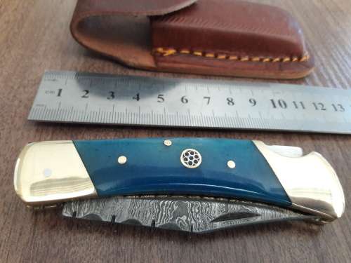 Handmade Damascus steel folding knife with CAMEL BONE handle scales.