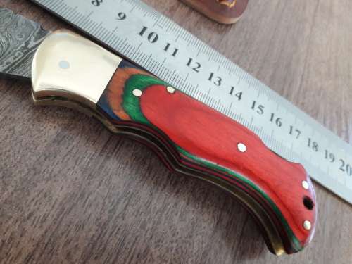 Handmade Damascus steel folding knife with WOODEN handle scales.