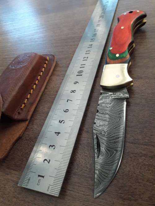 Handmade Damascus steel folding knife with WOODEN handle scales.